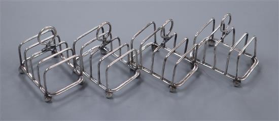 A set of four George V silver small five bar toastracks, R& W Sorley Sheffield, 1938.